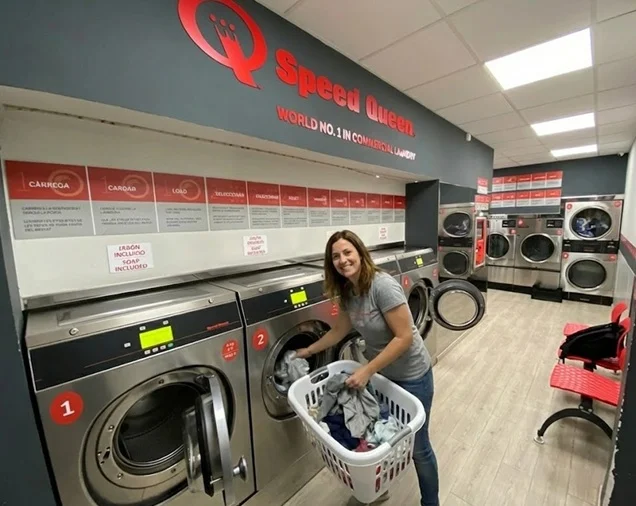 Speed Queen washers at Carrer del Carme 5 Ciutat Vella with red branded wall