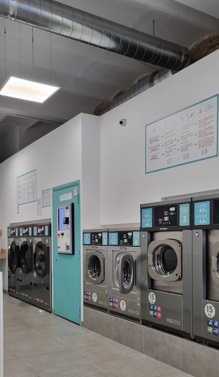 Washers and dryers inside LAVA Laundromat on Avinguda de Gaudí, Eixample, Barcelona